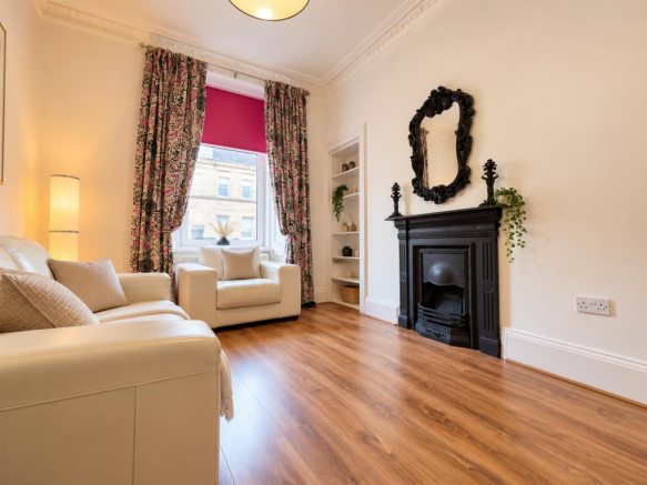 Elegant Living Room with Ornate Fireplace.png