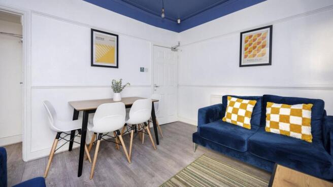 A bright and inviting large modern living room,...