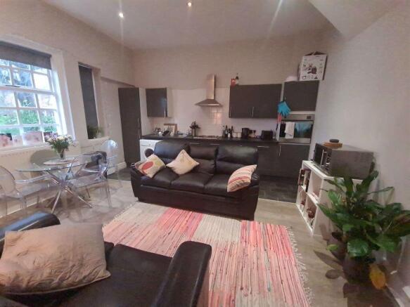 Bright and welcoming living room featuring a co...