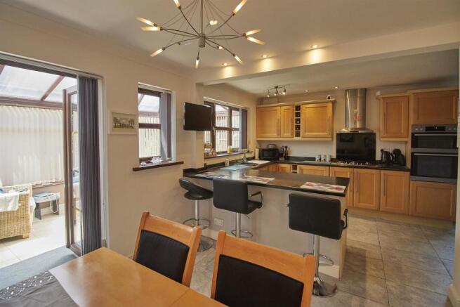 Fitted L shaped dining kitchen to rear