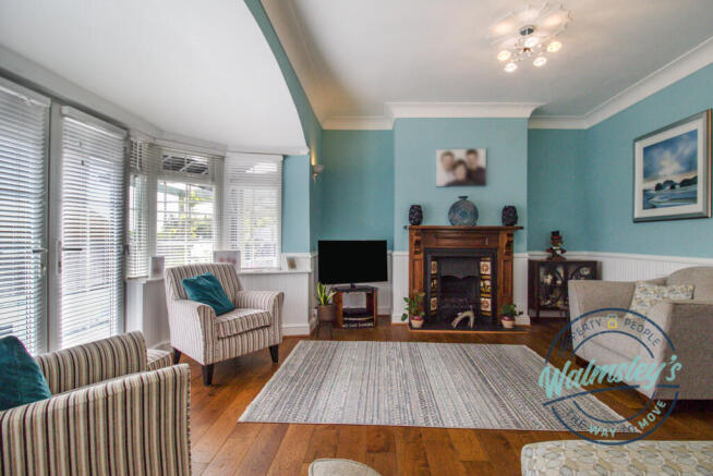Delightful sitting room with wide bay & French doo