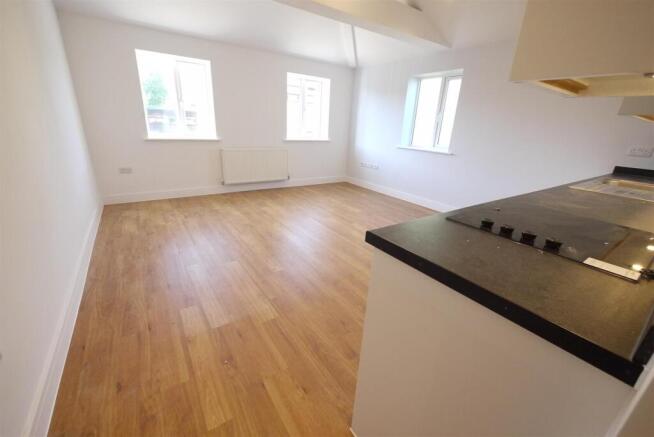 LIVING ROOM WITH OPEN PLAN KITCHEN