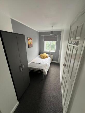 Neat single bedroom with a fitted wardrobe, coz...
