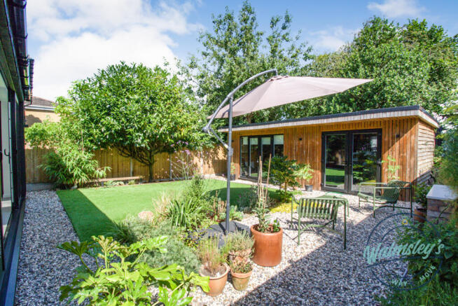 Rear gardens and impressive bespoke cabin