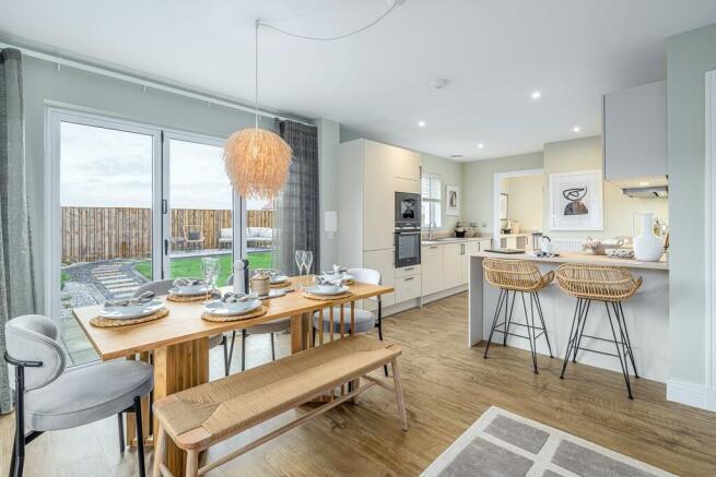 4 bedroom showhome | open plan studio-style kitchen, dining, and family area