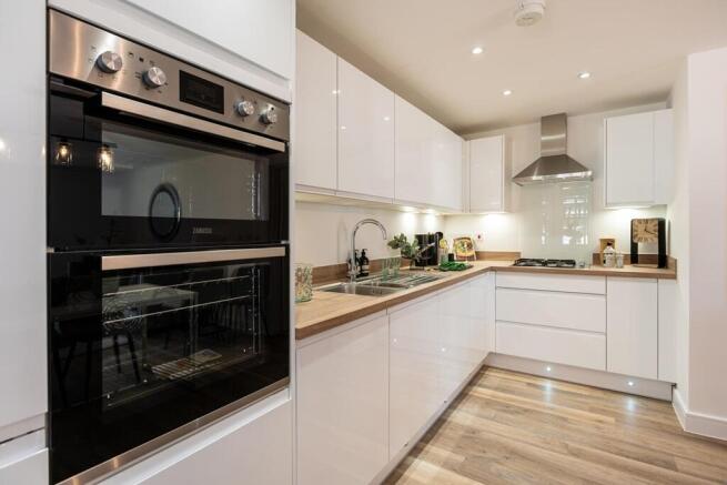 Stylish kitchen with ample storage - typical Taylor Wimpey home