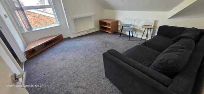 Bright living room with cozy sofa and carpet...
