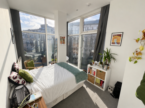 Sunlit UK bedroom with large windows-7.png