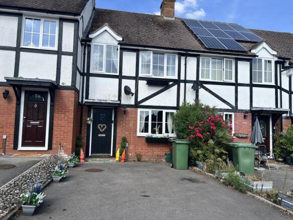 Front of property with driveway parking