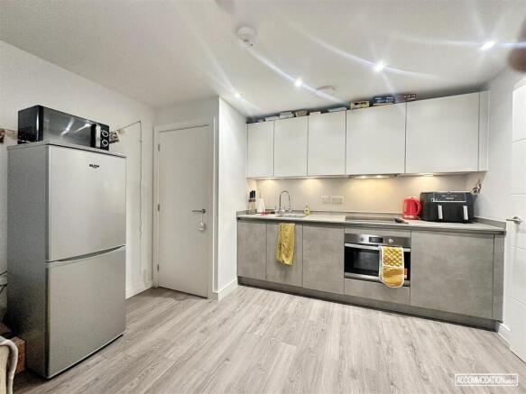 Sleek modern kitchen with integrated appliances...