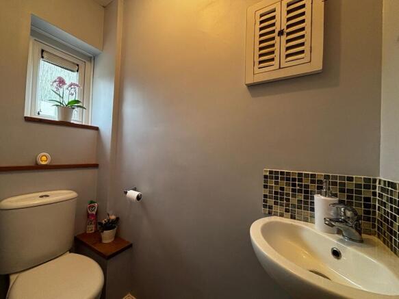 Modern cloakroom with stylish mosaic tiling....