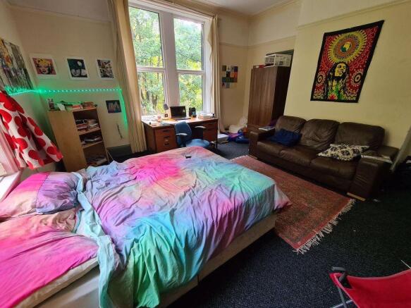 Bright and inviting master bedroom featuring a ...