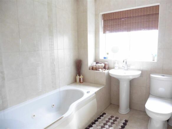 Modern fully tiled bathroom