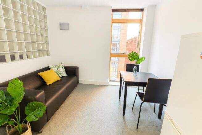 Bright and tidy living room with a comfortable ...