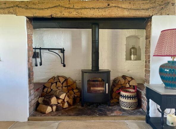 Inglenook fireplace with log burner