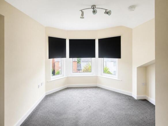 Spacious master bedroom with bright bay window...