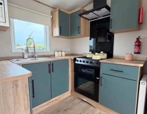 Contemporary Kitchen With Green Cabinets, Wood Eff