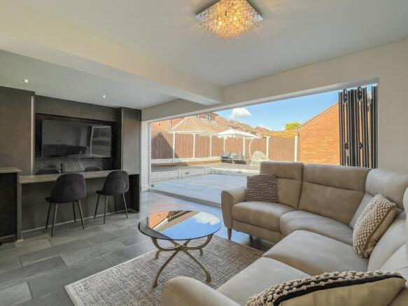 OPEN PLAN STYLE KITCHEN AND SITTING AREA