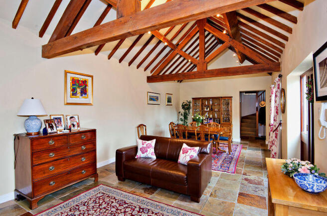 Versatile dining/living space with oak beams and s