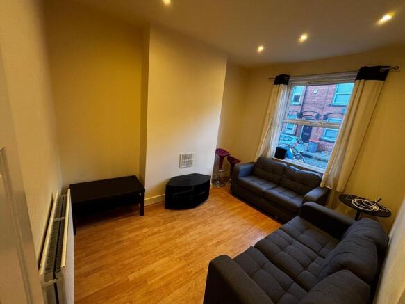 Bright, modern living room with two matching so...