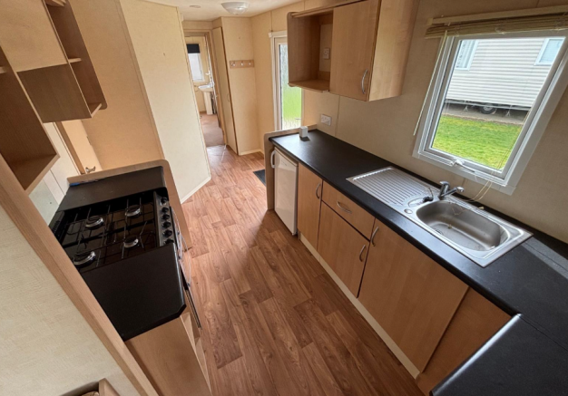 Abi Vista Galley Style Kitchen With Wooden Cupboar