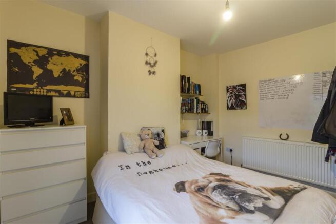 Cozy double bedroom with desk and ample storage...