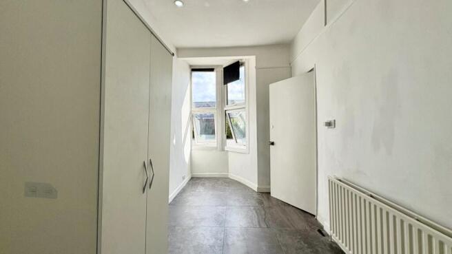 Bright and clean bedroom with built-in wardrobe...