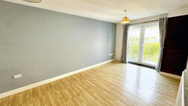 Bright living room with stylish French doors....