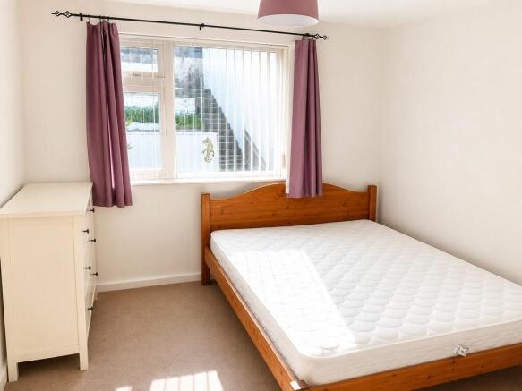 Bright and tidy bedroom with a comfy double bed...