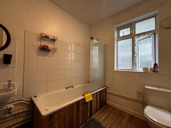 Spacious bathroom suite featuring a full bathtu...