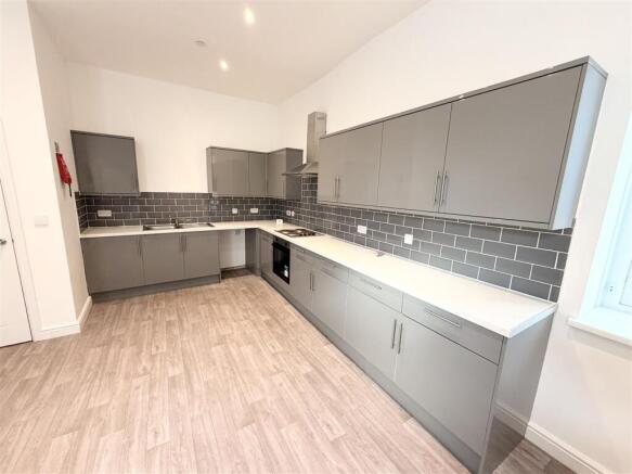 Sleek contemporary kitchen with ample storage...