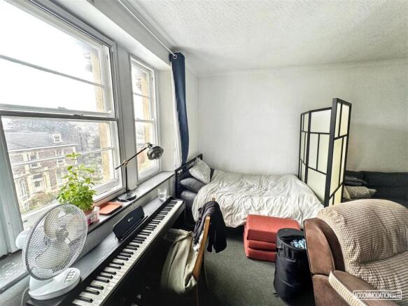 Bright and spacious bedroom with large windows...