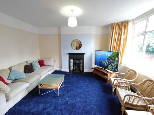 Bright, comfortable living room with a large ba...