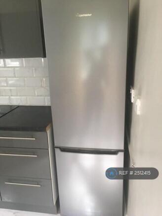 Freestanding Fridge Freezer In Kitchen