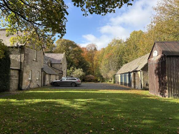 Front of house and outbuildings