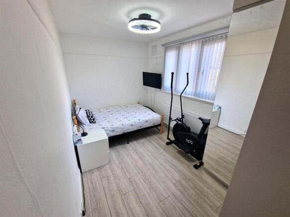 Bright and tidy double bedroom featuring modern...