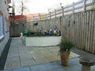 Paved patio area and water feature
