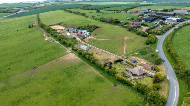 Paddocks to rear of Stables.jpg