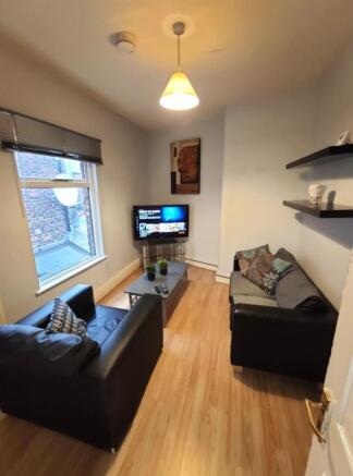 Compact, neatly presented living room with two ...