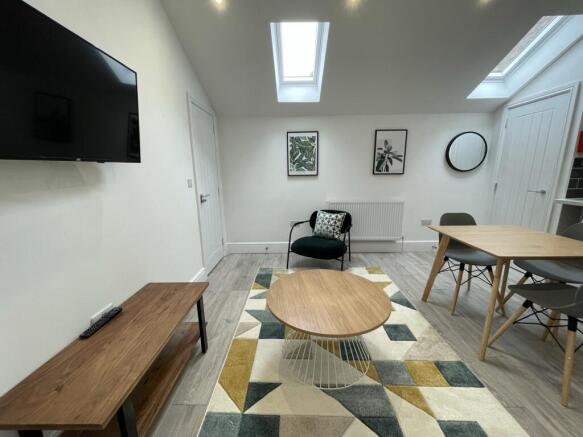 A bright and stylish large modern living room p...