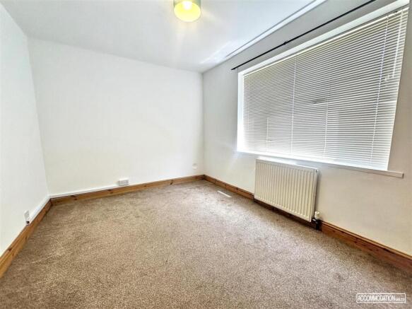 Bright and airy bedroom with large windows...