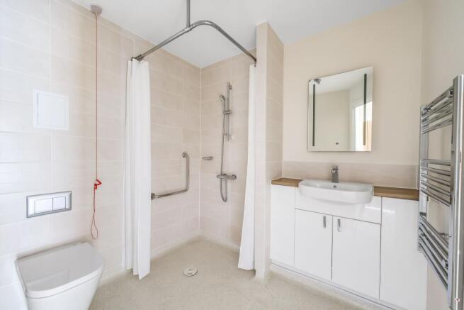 a bathroom with a shower and sink