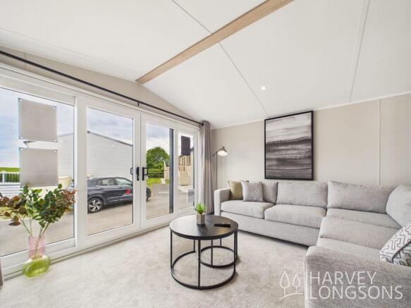 Spacious Living Area with Patio Doors in the Victo