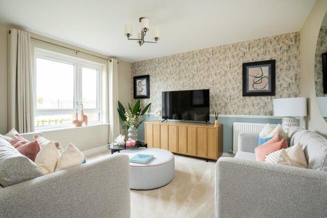 Spacious lounge to the front of the home