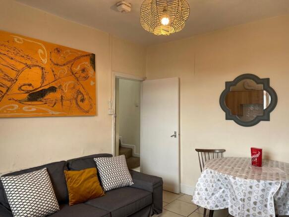 A bright and inviting living room featuring a c...