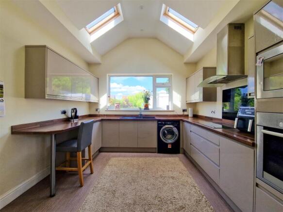 Kitchen with vaulted ceiling