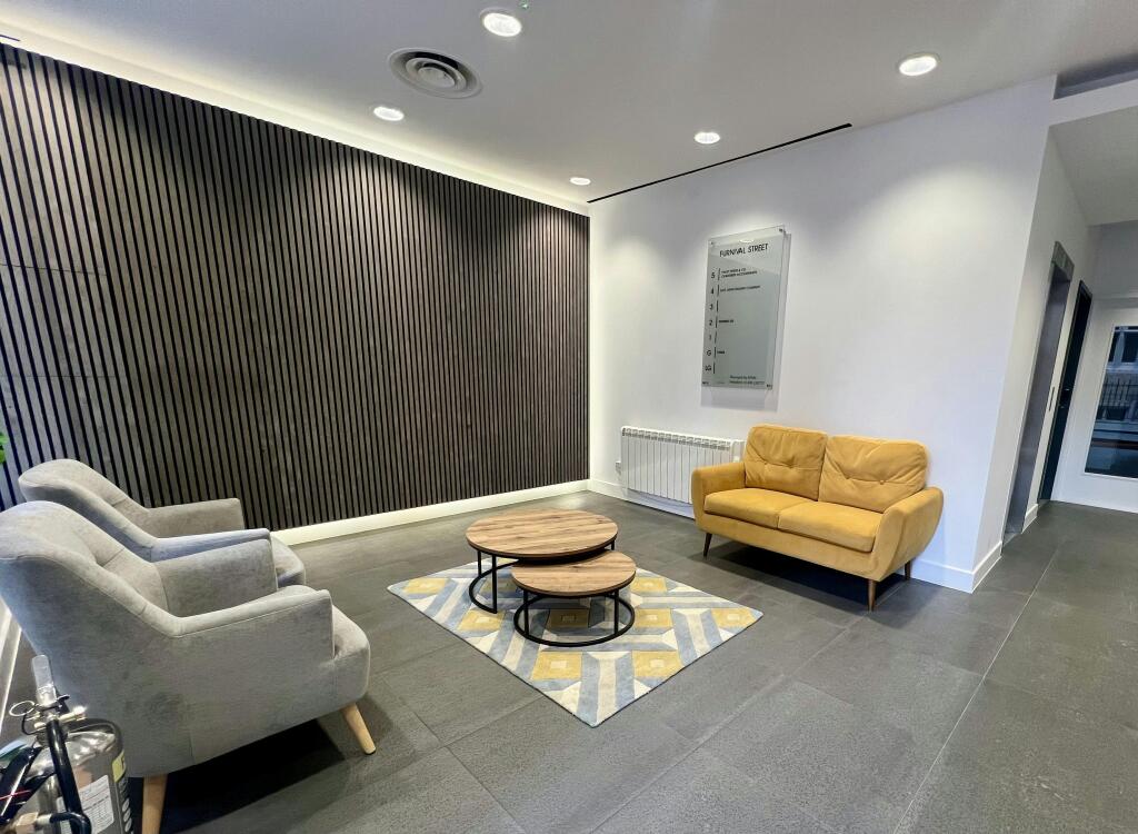 3031 Furnival Modern Lobby With Seating And Decorative Wall Paneling.jpg