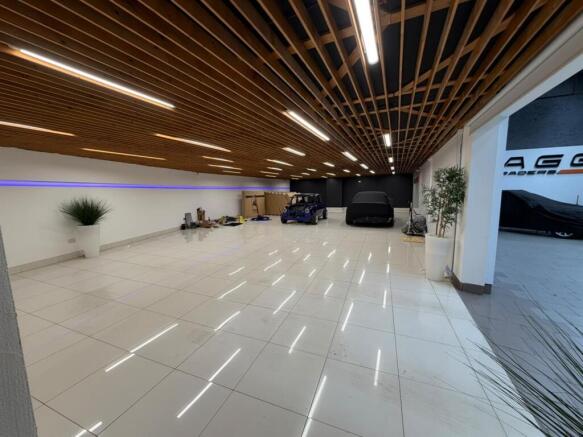 03_Left_Showroom_Tiled_Floor_Wooden_Ceiling.jpeg