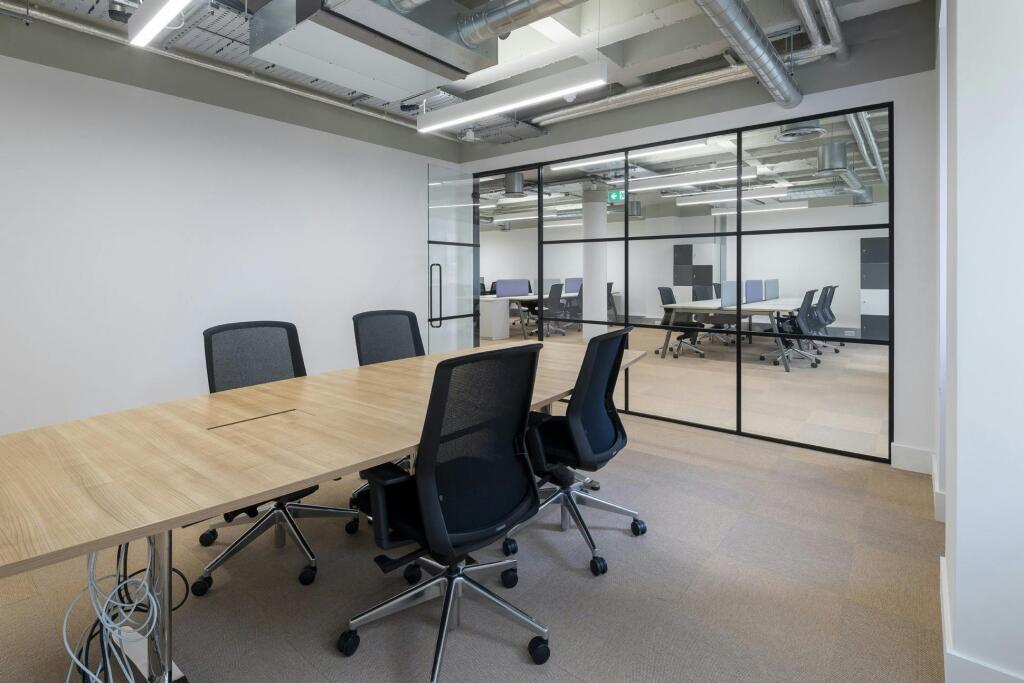 30-31 Furnival Street Modern Conference Room With Glass Partitions And Office Chairs.jpg