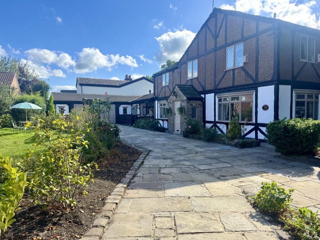 Main image of property: Lychgate Cottage, Town Lane, Denton, M34 — Character period home with 64m² garage/workshop & gated parking for 6+